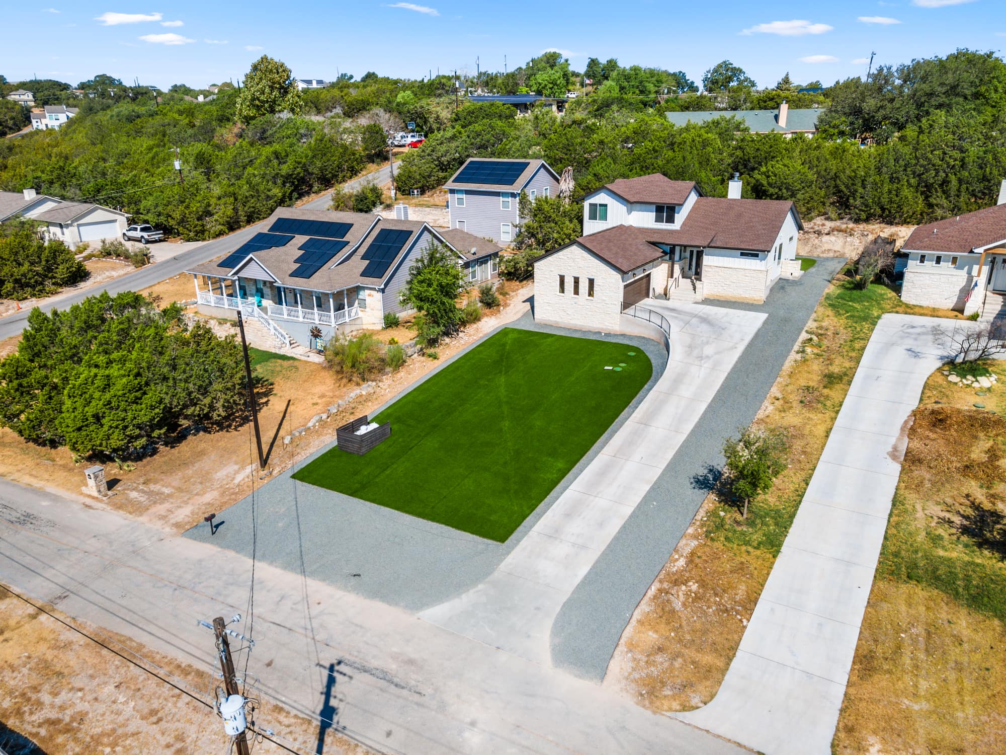 Aerial view of an artificial turf lawn in Los Alamitos installed by HaloTurf