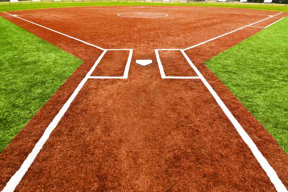 Batter walking (across artificial turf) up to the plate/ artificial turf for baseball