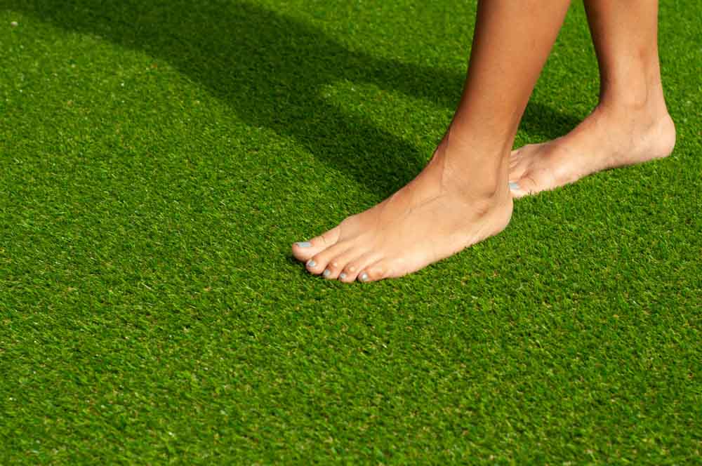 people walking on artificial turf
